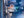 An image of an astronaut surrounded by people