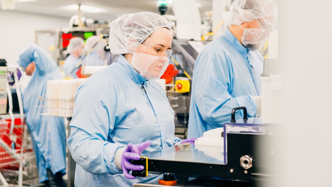 Employee operates the filter trimmer in Jaffrey, USA