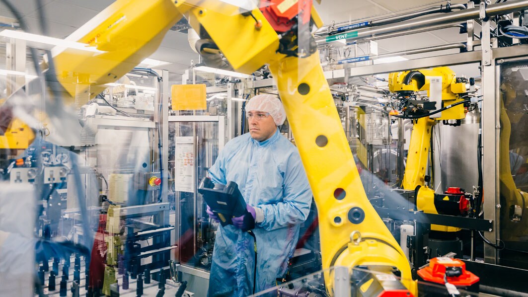 Employees testing the robot control system in production in Jaffrey, USA