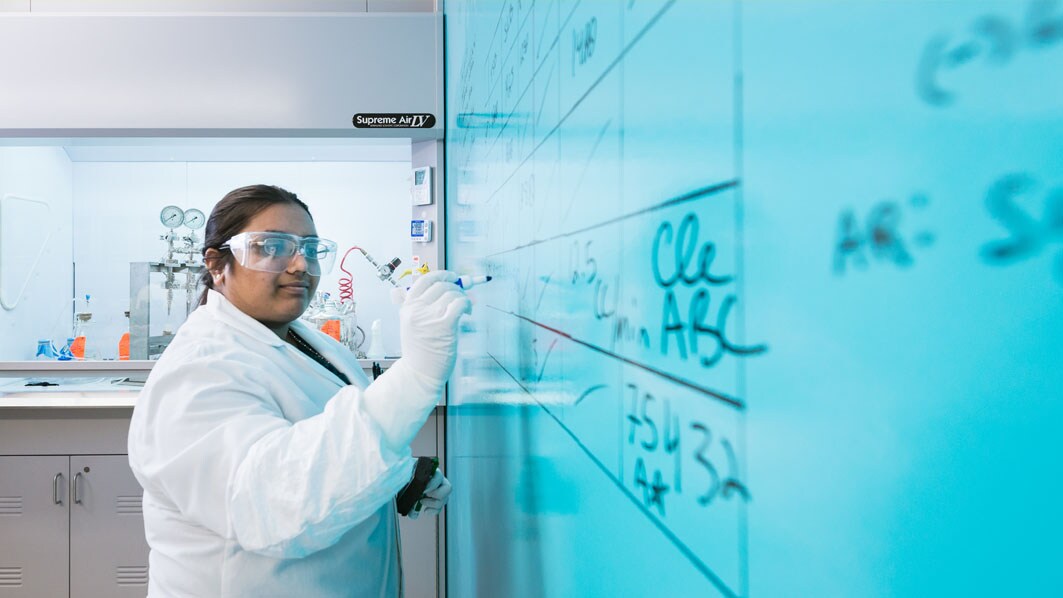 Employee calculating the bacterial concentration of a customer's filtration validation in the M Lab in Burlington, USA.