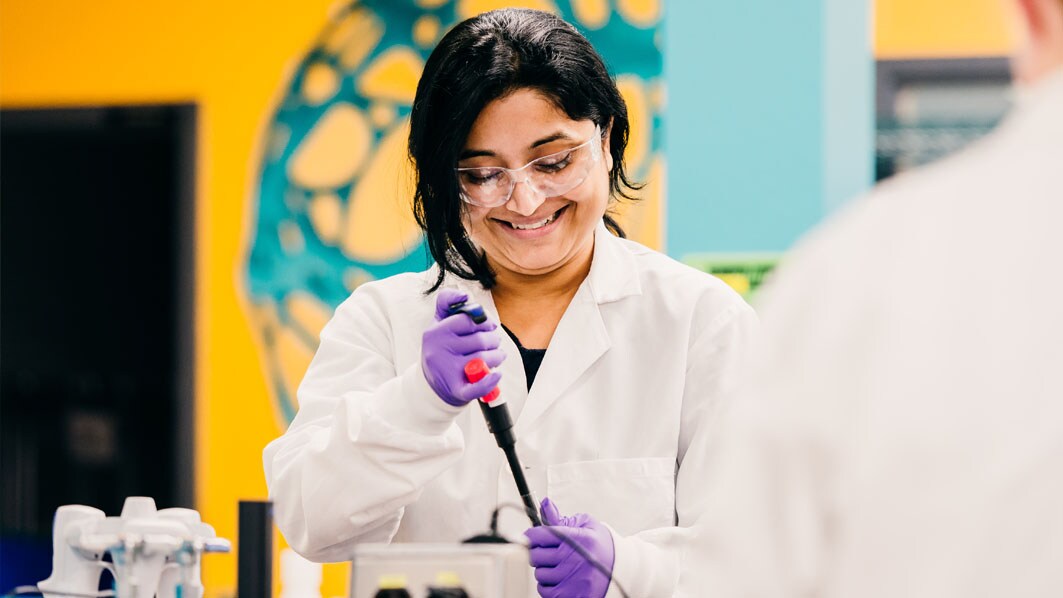 Employee uses a pipette to draw a sample from a dilution tube in a quality lab in Jaffrey, USA.