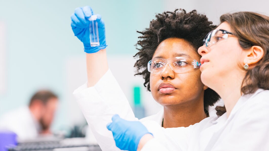 Employees working in the quality control lab in St. Louis, USA (Dekalb facility).