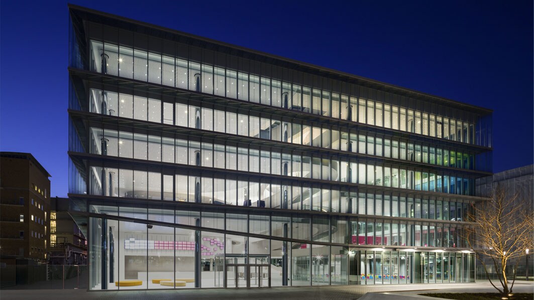 The Innovation Center by night at the headquarters in Darmstadt, Germany. Front view.