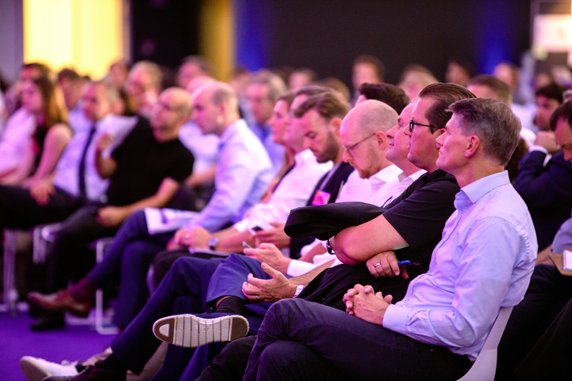 Listening to the talks in a filled auditorium