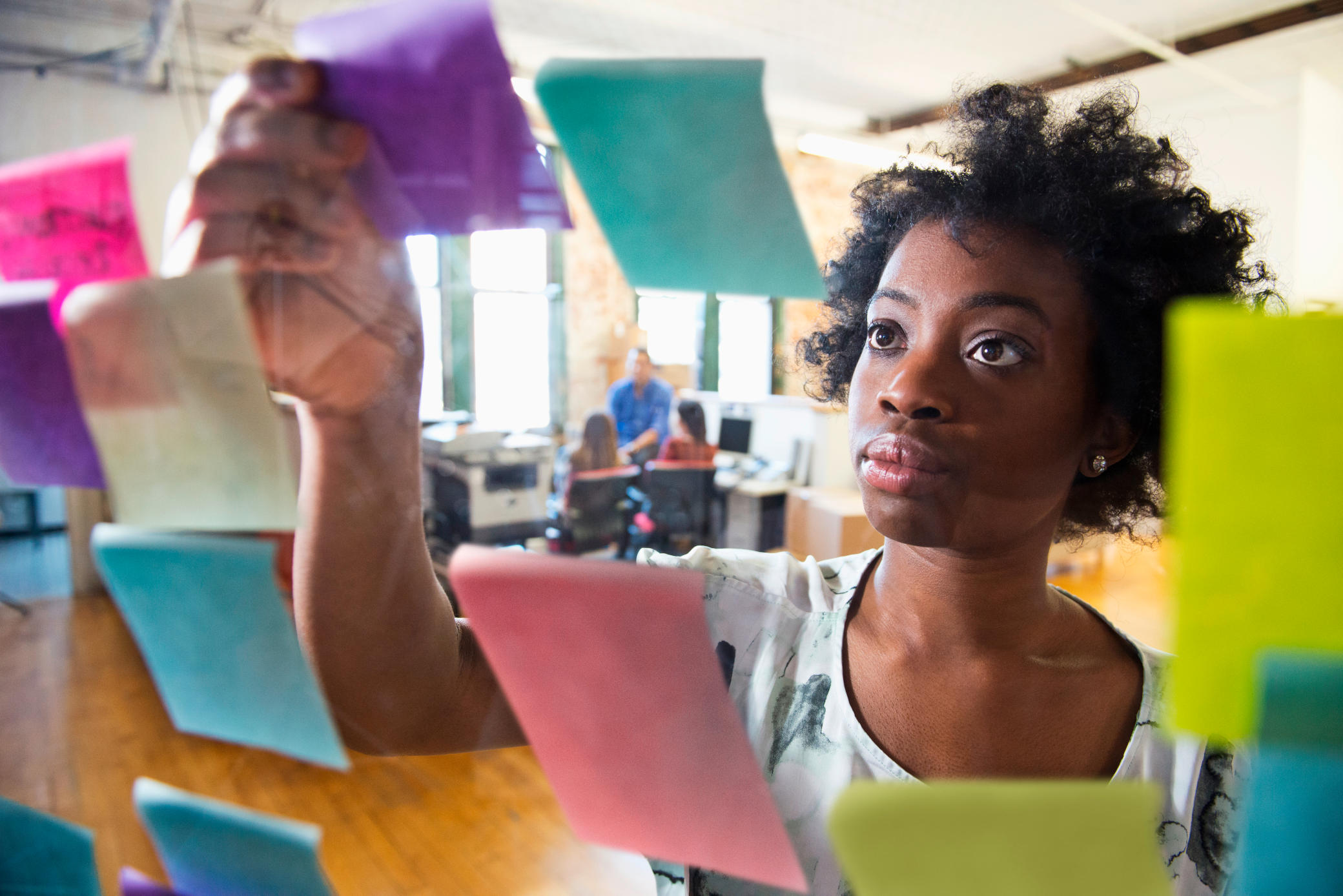 Girl attaching notes