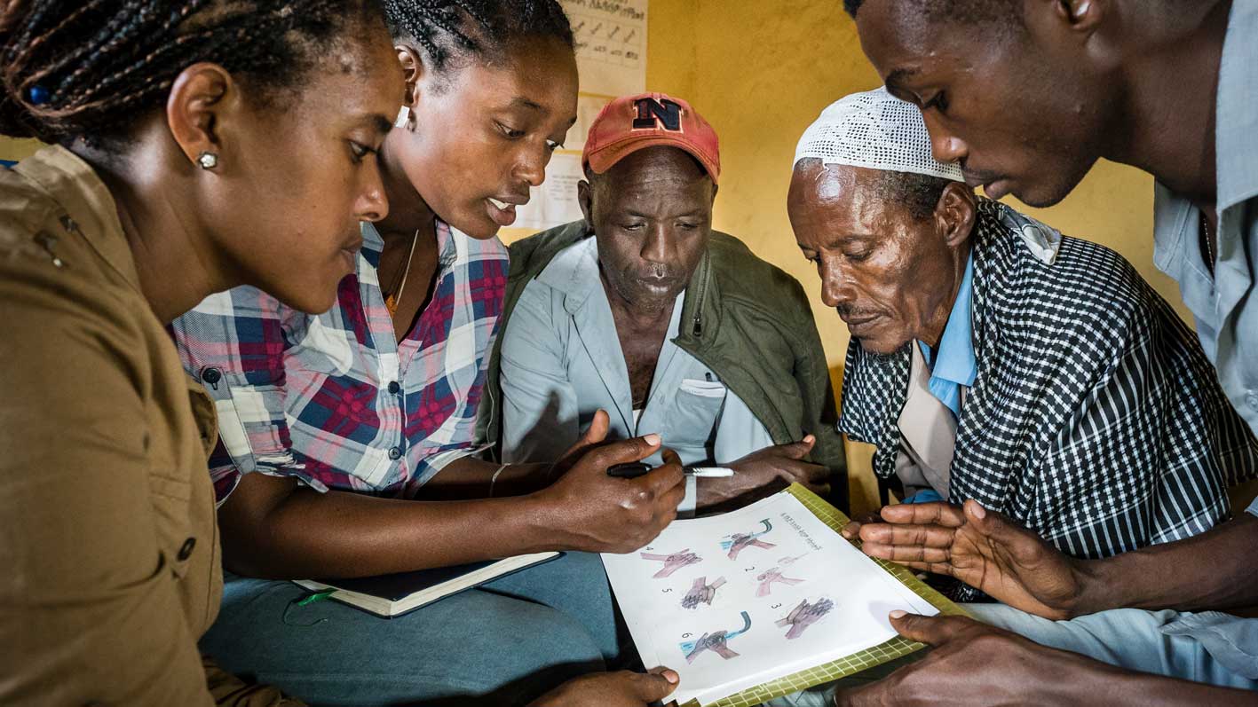 Boy playing at a river