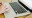 Two hands on the keyboard of a laptop