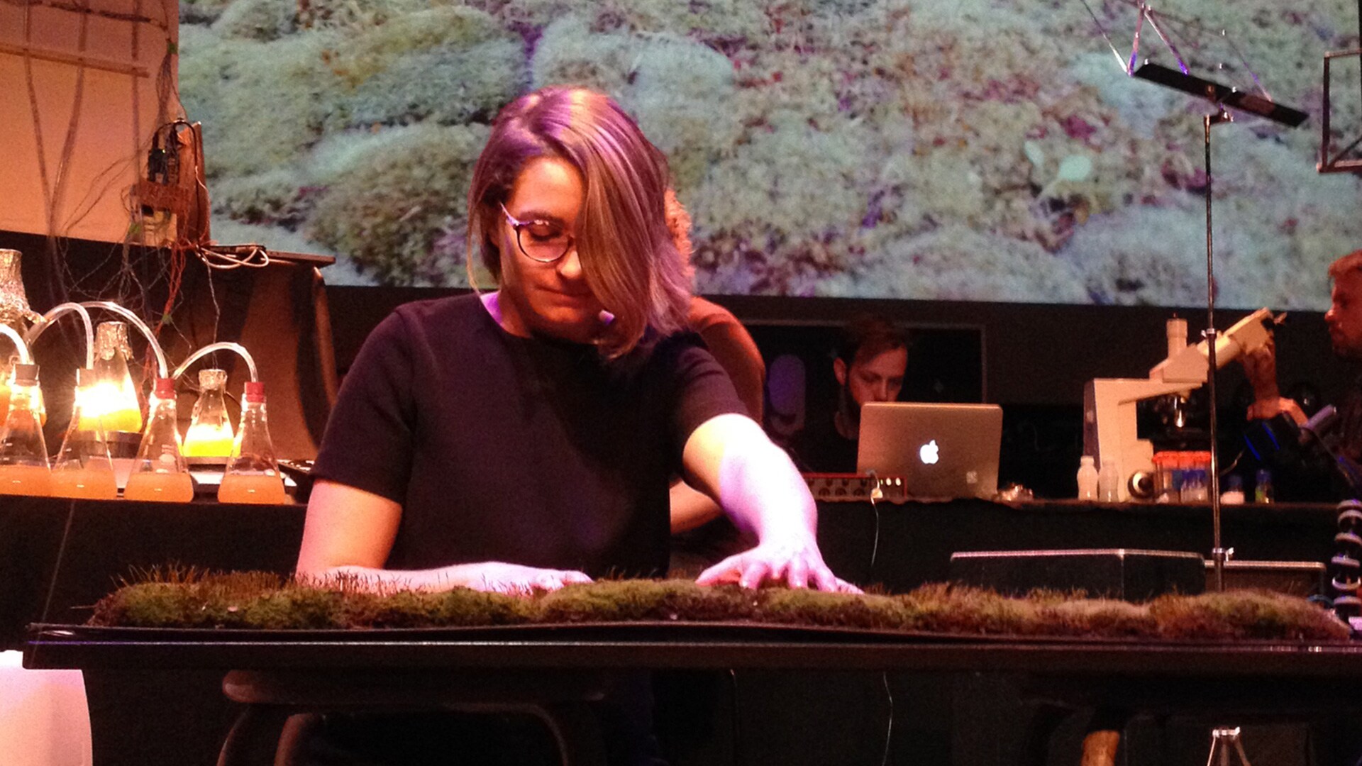 Person touching moss