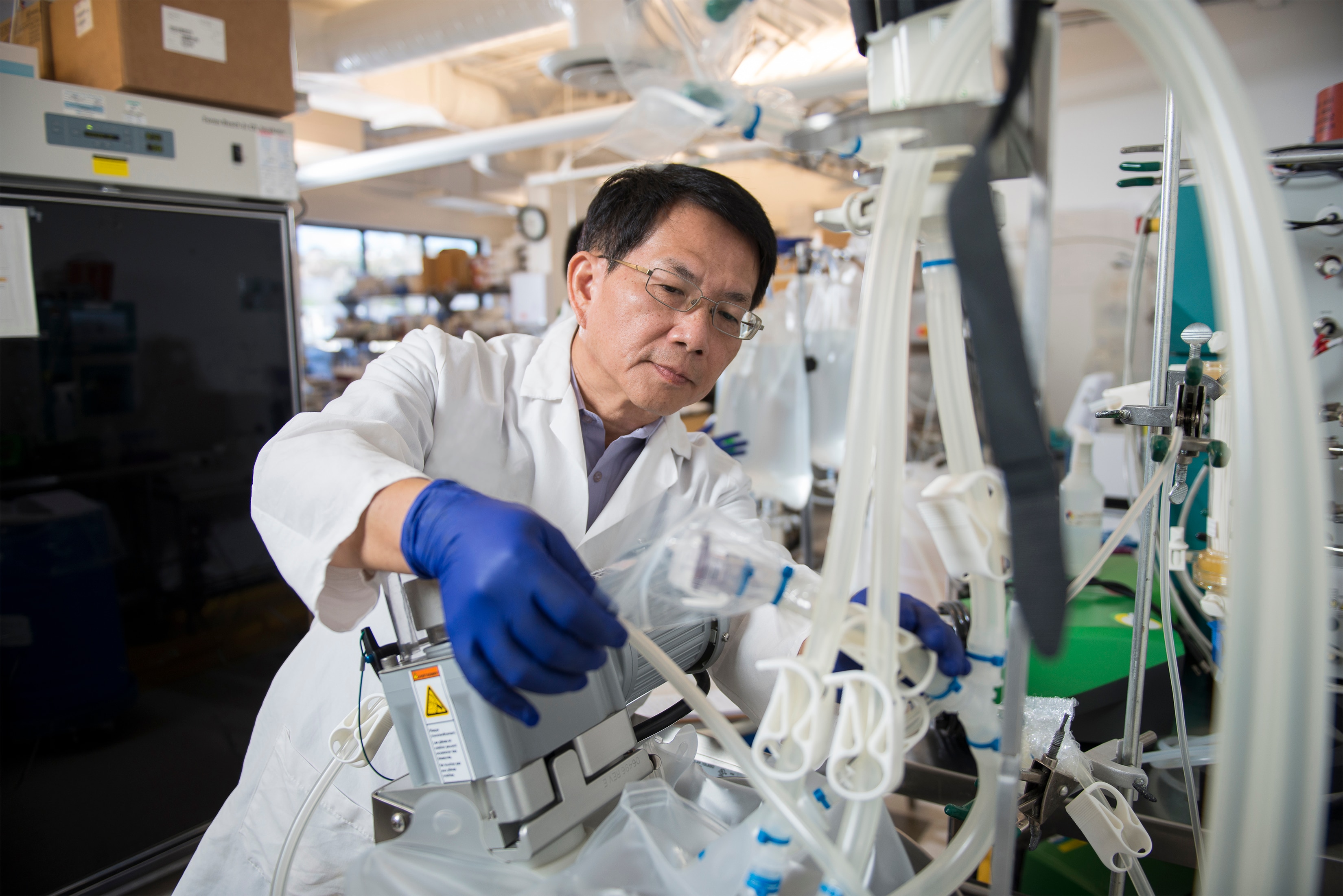 Ching-I Chen, Ph.D. process development lead at Tocagen setting up a bioreactor